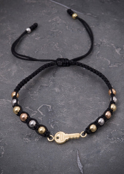 Pulsera en hilo negro con herraje llave 1.55gr / Tres Oros (Joya) P