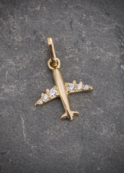 Dije avion con swarovski blanco 0.8gr / Largo 1.8cm / Oro Amarillo Nac P