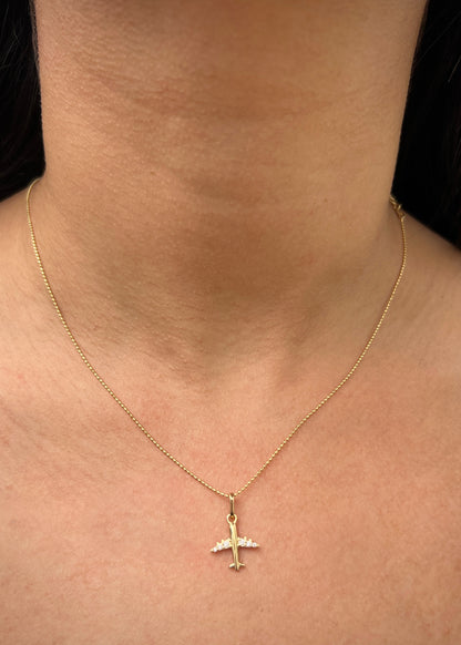 Dije avion con swarovski blanco 0.8gr / Largo 1.8cm / Oro Amarillo Nac P