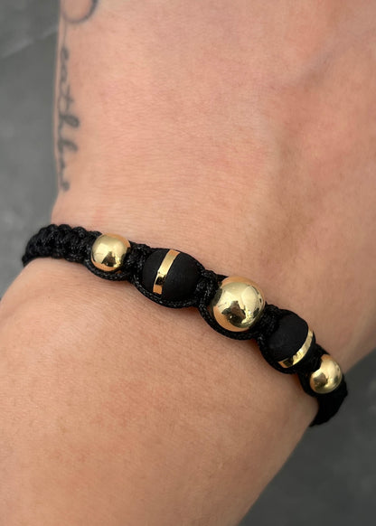 Pulsera en hilo negro con bolas lisas y neoros 0.8gr / Oro Amarillo (Joya) M