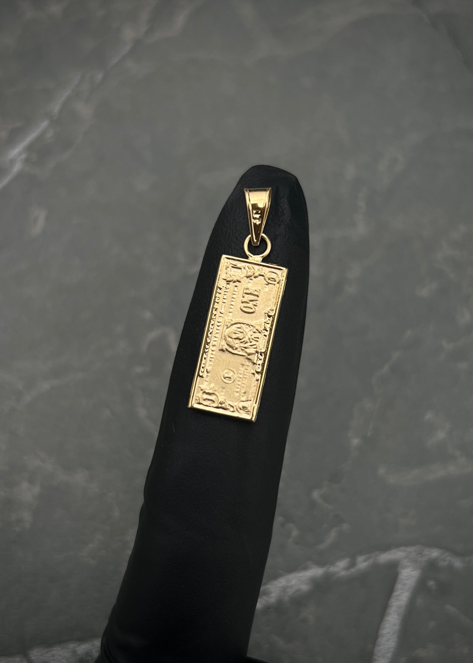 Dije dolar 0.8gr / Largo 2.2cm / Oro Amarillo Nac P