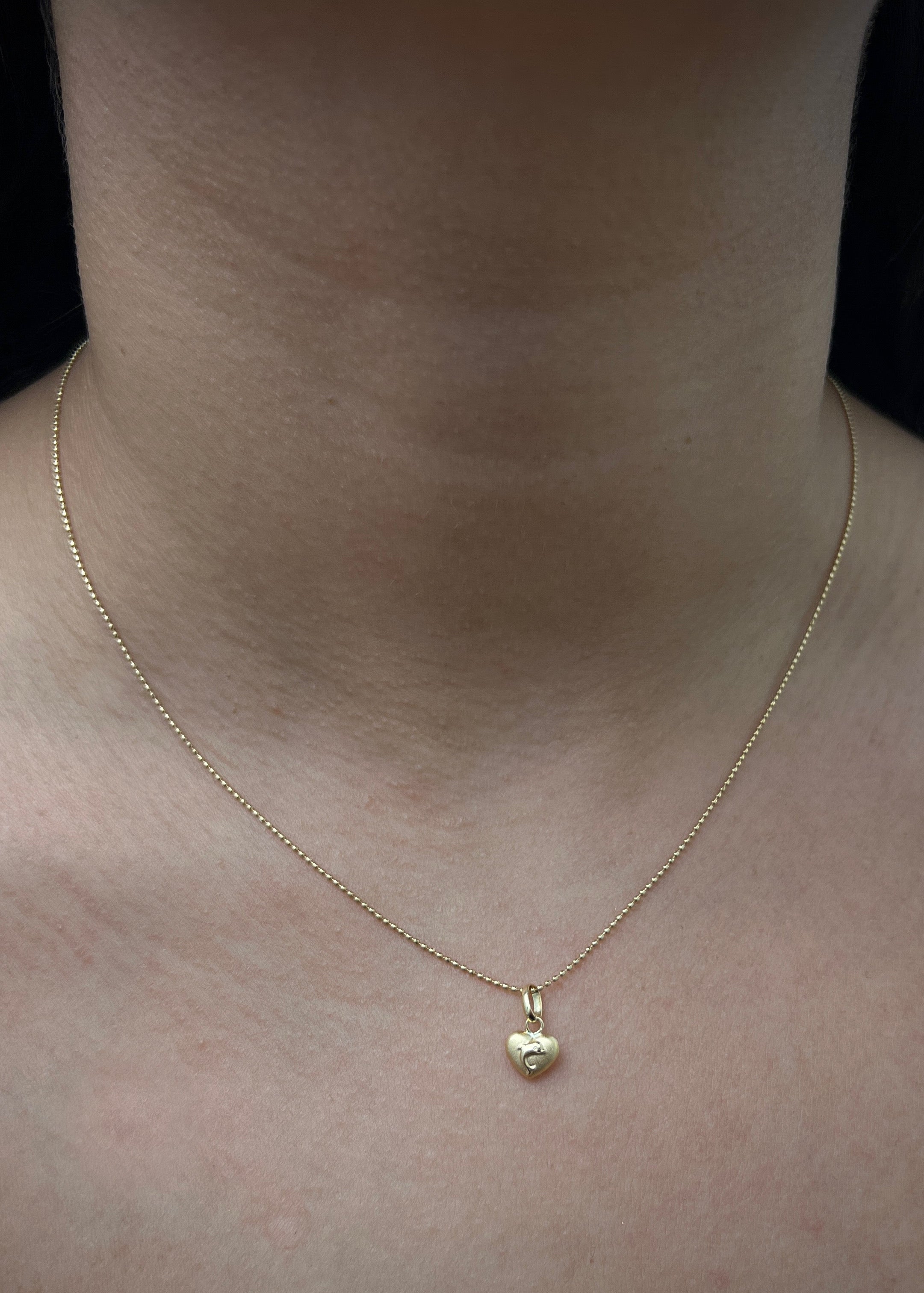 Dije de corazon con delfin 0.3gr / Largo 1.2cm / Oro Amarillo Nac B