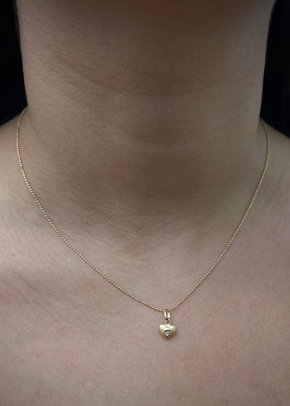 Dije de corazon con delfin 0.3gr / Largo 1.2cm / Oro Amarillo Nac B