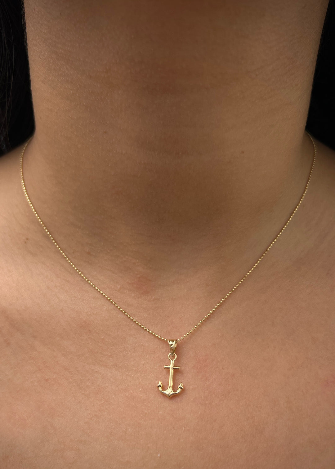Dije de ancla 0.4gr / Largo 1.9cm — Oro Amarillo