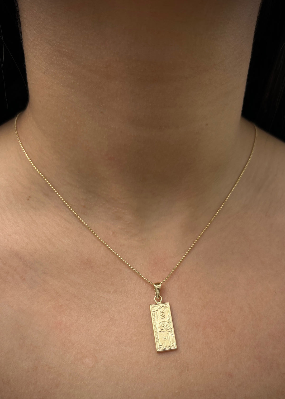 Dije dolar 1.4gr / Largo 2.9cm / Oro Amarillo Nac M