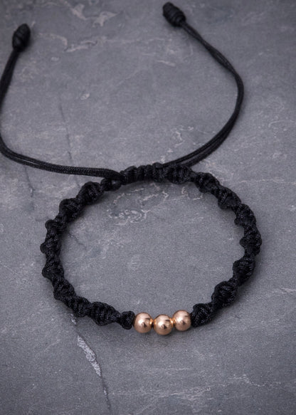 Pulsera en Hilo negro con bolas lisas 0.3gr / Oro Rosado (Joya) M