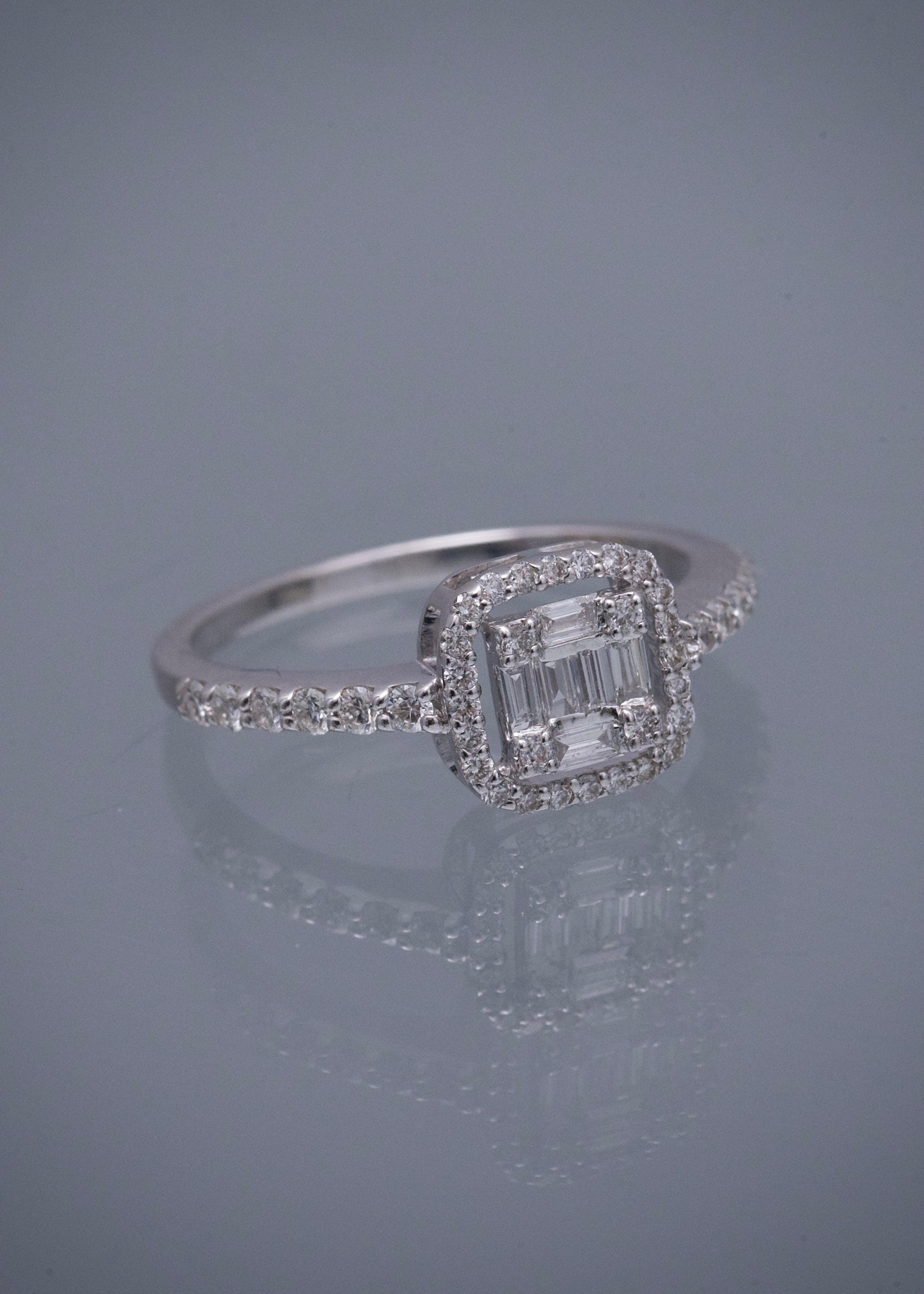 Solitario con 39pts de diamante central y 15pts laterales 2.8gr / TALLA 6 1/2 / Oro Blanco (Joya) M