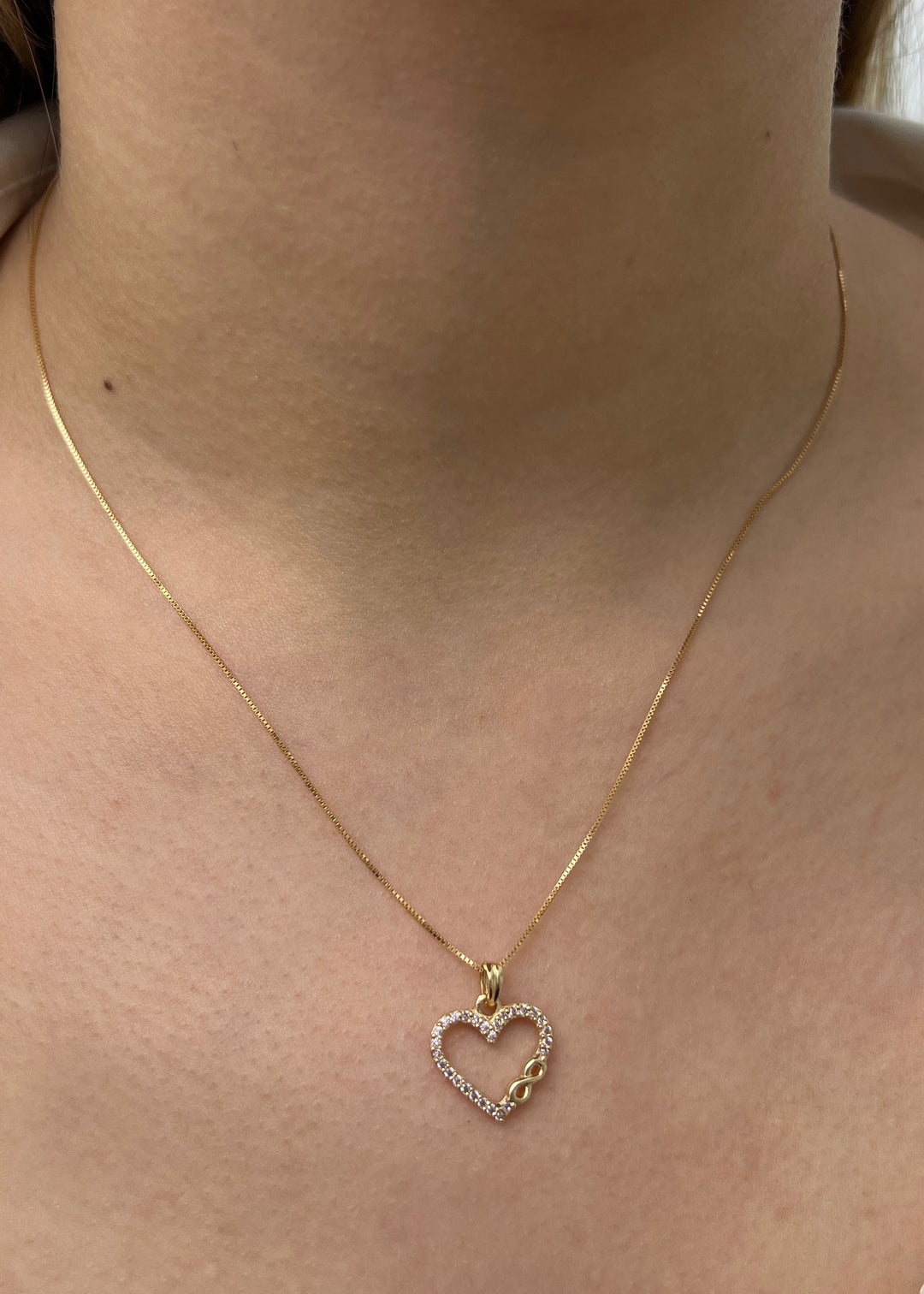 Dije corazon con swarovski rosado 1.2gr / Largo 1.7cm — Oro Amarillo