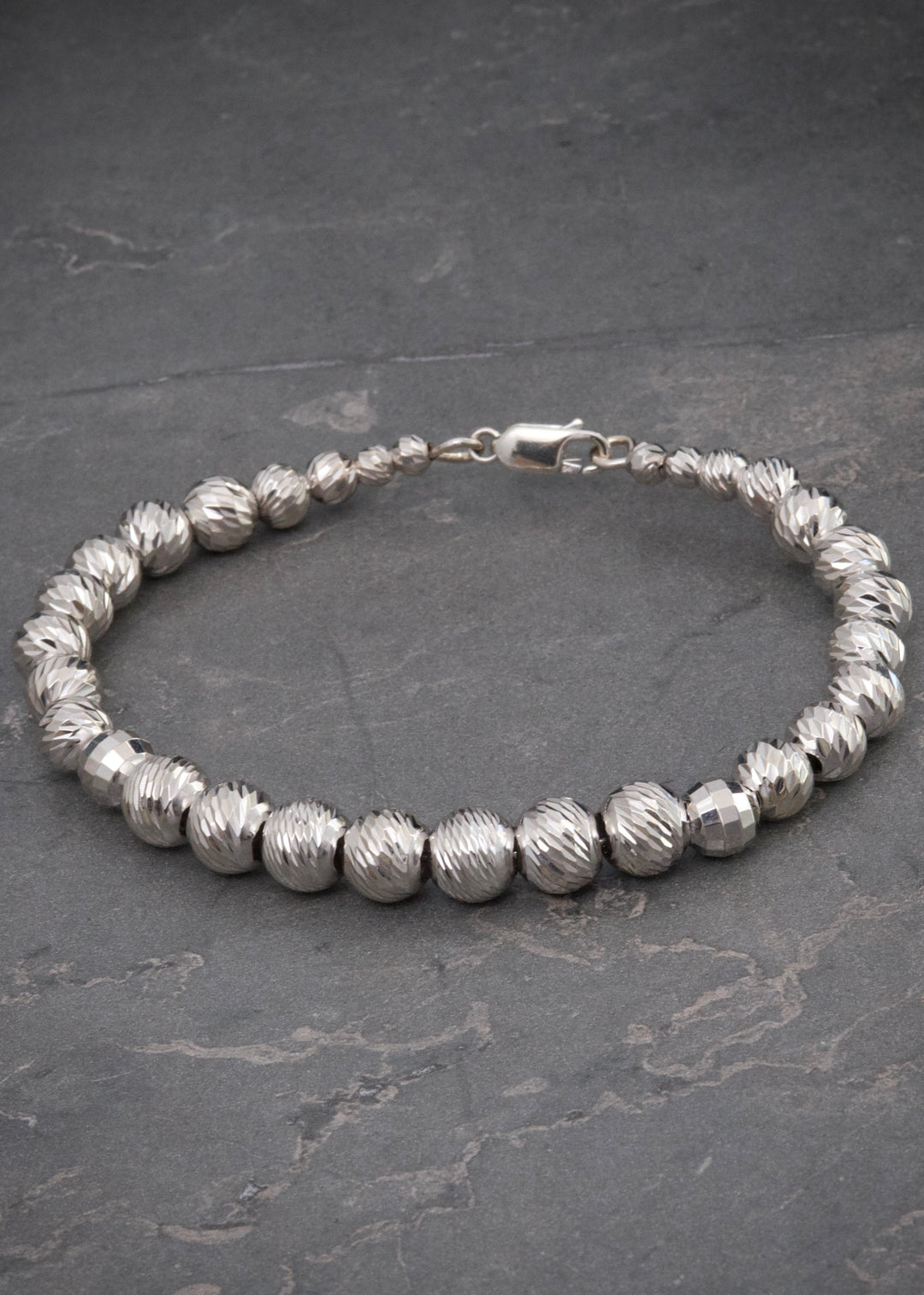 Pulso con bolas diamantadas 13gr / Largo 19cm — Oro Blanco
