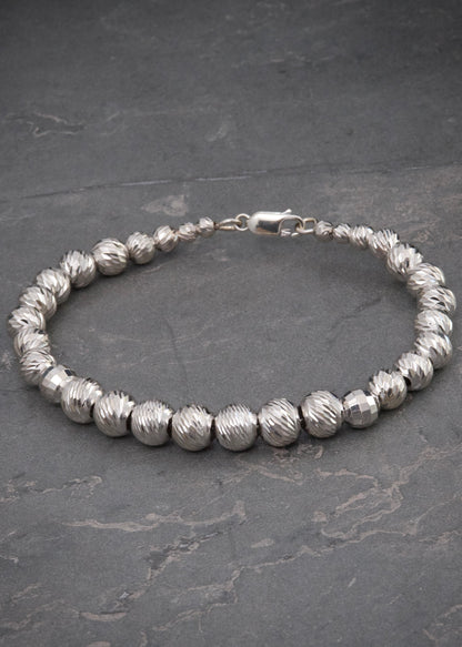 Pulso con bolas diamantadas 13gr / Largo 19cm — Oro Blanco
