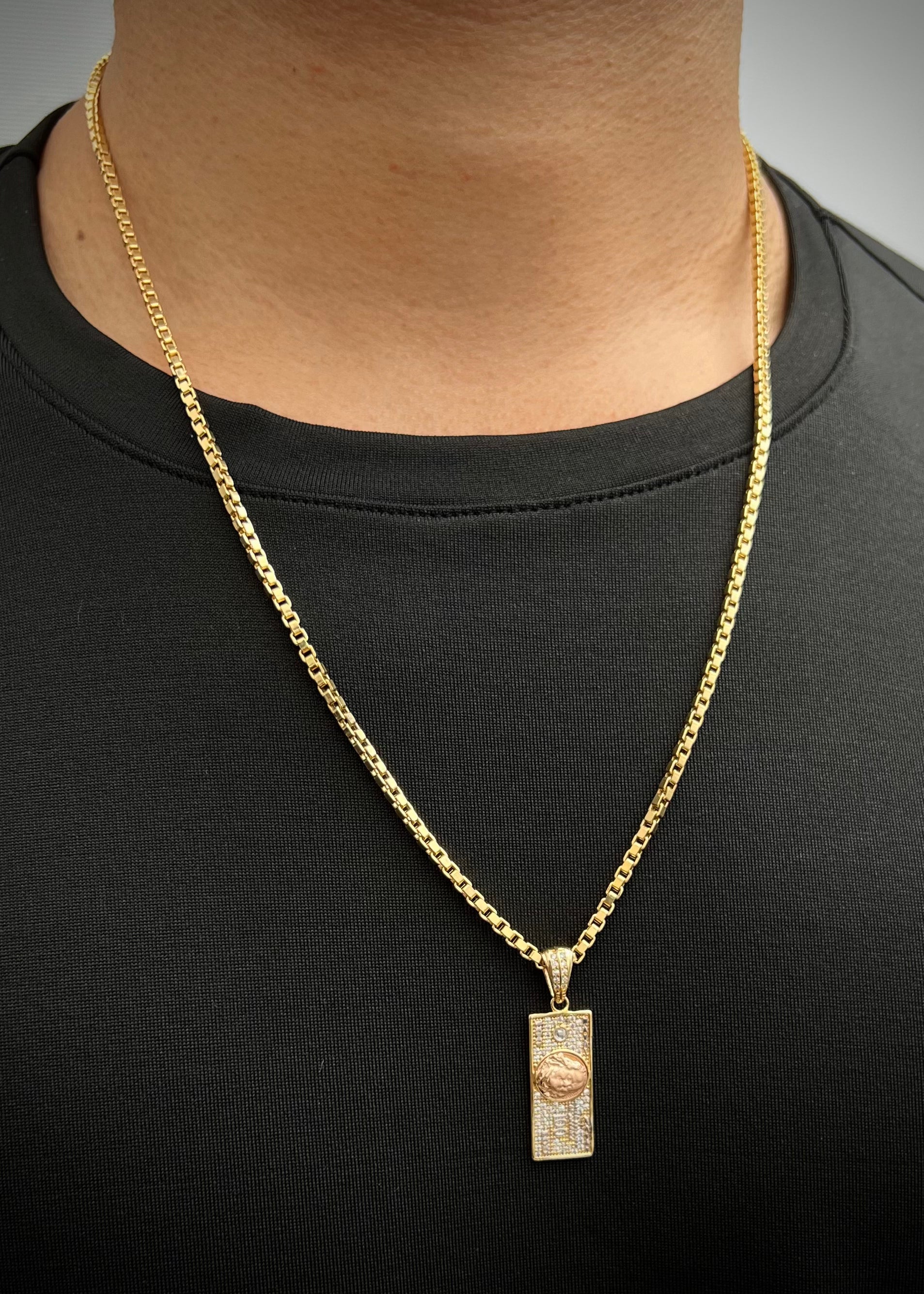 Dije dolar con swarovski blanco 3.45gr / Largo 3.4cm / Dos Oros Nac B