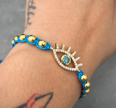 Pulsera en hilo azul con 38pts de diamante azul y 44pts de diamante blanco  4.35gr / Oro Amarillo (Joya) M