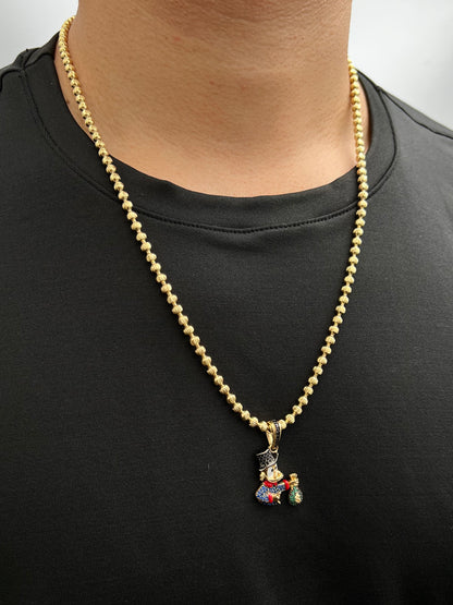 Dije tio rico con swarovski azul y negro 5.6gr / Largo 3.5cm / Oro Amarillo Nac P