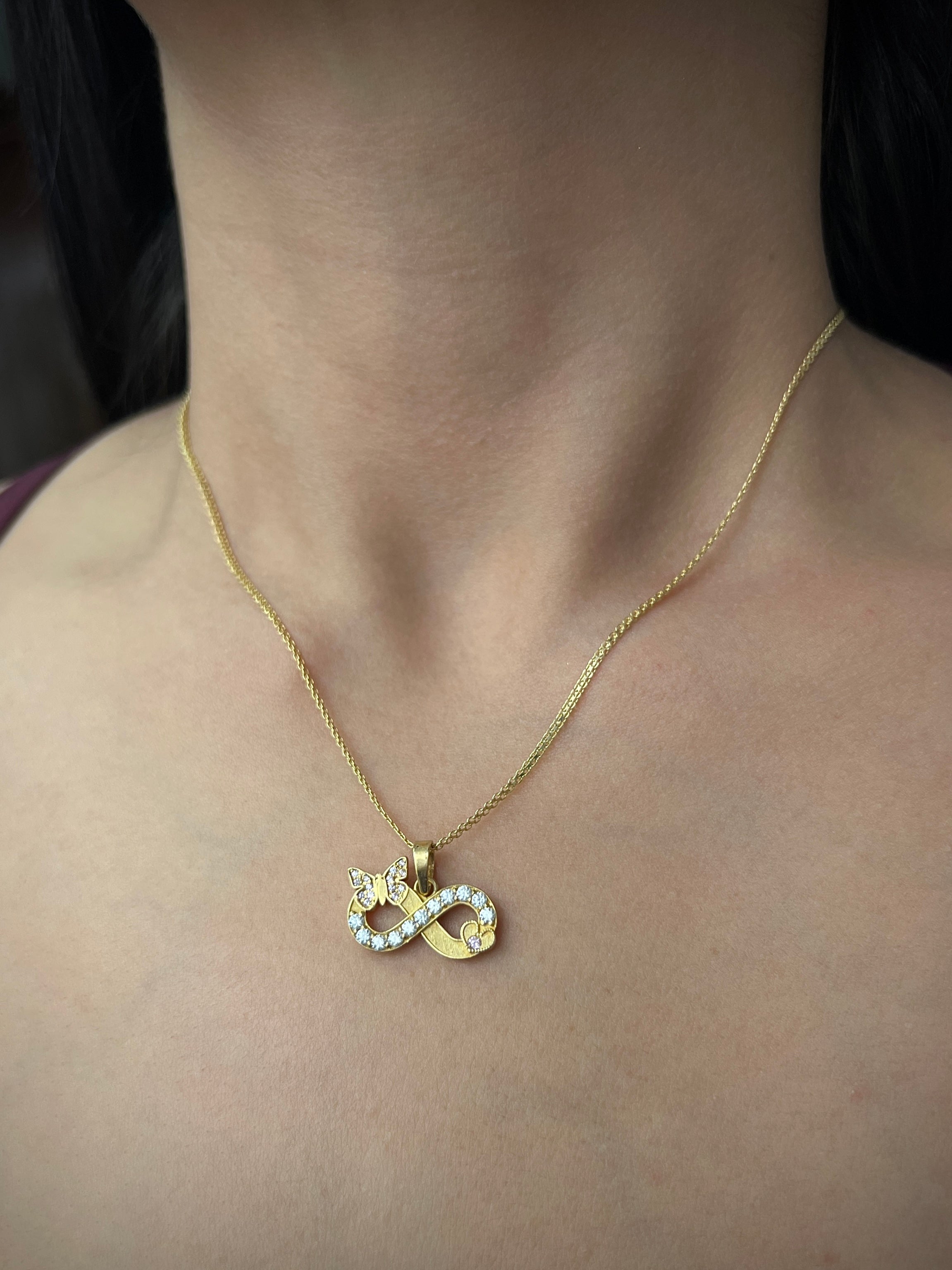 Dije de infinito con moissanitas 0.38qts (38pts) 3.1gr / Oro Amarillo (Joya) P