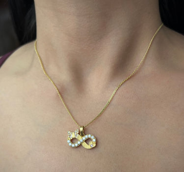 Dije de infinito con moissanitas 0.38qts (38pts) 3.1gr / Oro Amarillo (Joya) P