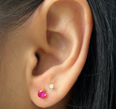 Topos con swarovski fucsia 0.85gr / 0.4cm / Oro Amarillo Nac M