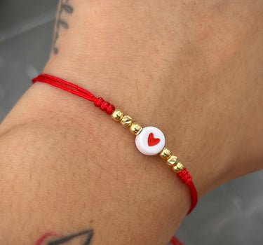 Pulsera en hilo rojo con corazon mas bolas lisas y diamantadas 0.3gr / Oro Amarillo (Joya) M