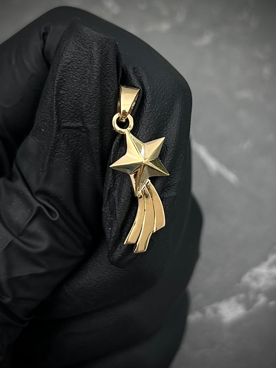 Dije estrella fugaz 2gr / largo 2.6cm — Oro Amarillo