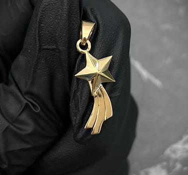 Dije estrella fugaz 2.15gr / largo 2.6cm / Oro Amarillo Nac M