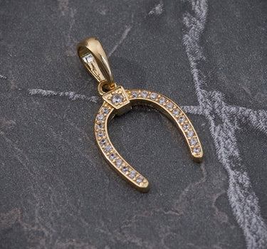 Dije De herradura con swarovski blanco 1gr / Largo 2.1cm / Oro Amarillo Nac M