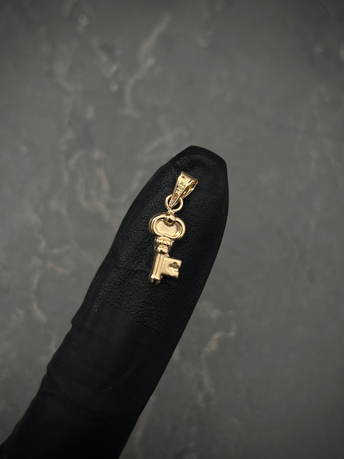 Dije de llave 0.45gr / Largo 2cm / Oro Amarillo Nac M