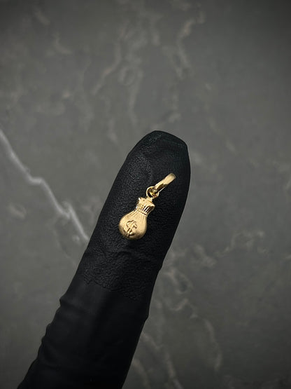 Dije bolsa de dinero 0.3gr / Largo 1.5cm / Oro Amarillo Nac M
