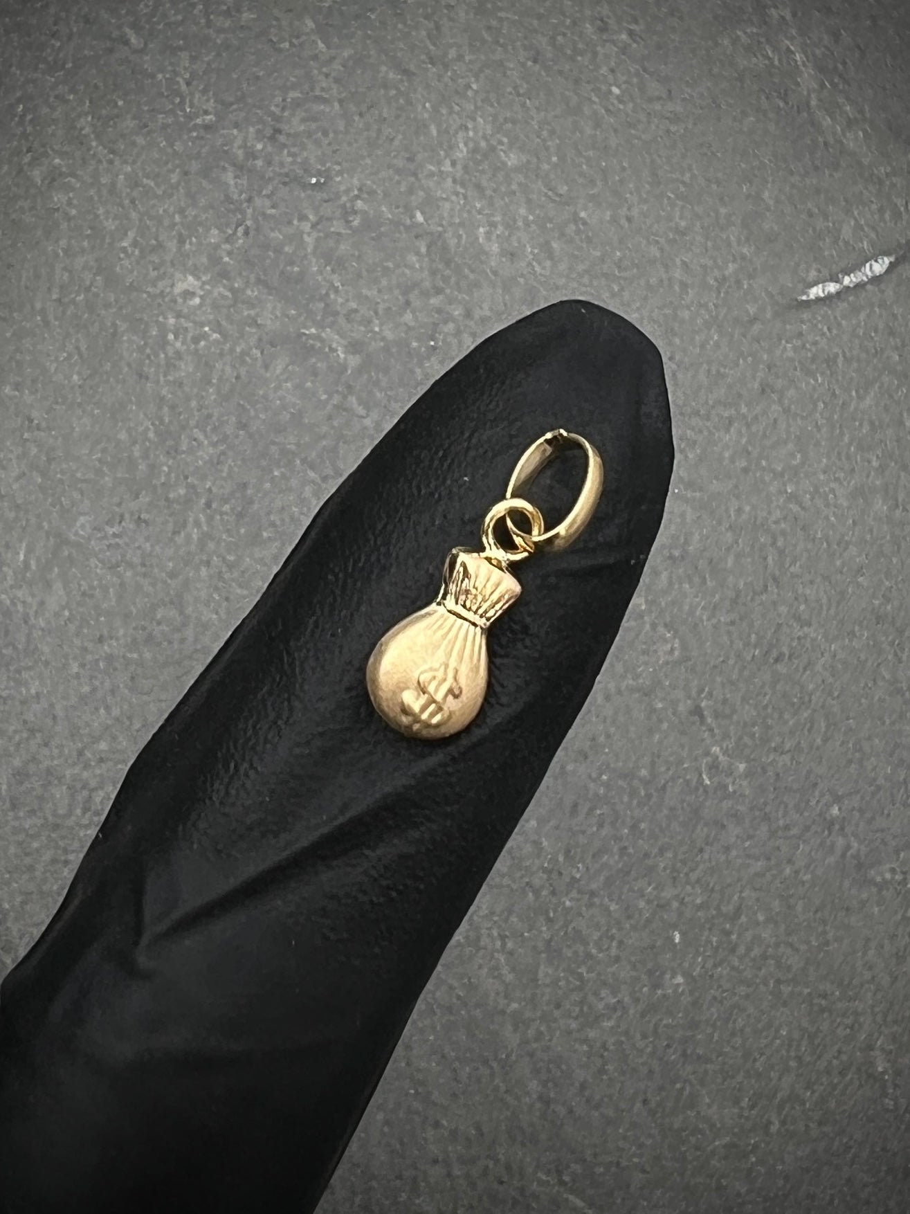 Dije bolsa de dinero 0.3gr / Largo 1.5cm / Oro Amarillo Nac P