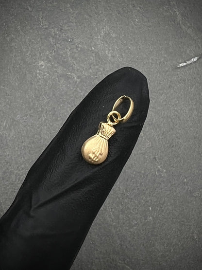 Dije bolsa de dinero 0.3gr / Largo 1.5cm / Oro Amarillo Nac P