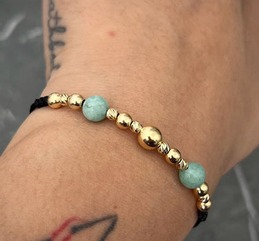 Pulsera en hilo negro  con 355pts de morralla  1.1gr / Oro Amarillo (Joya) M