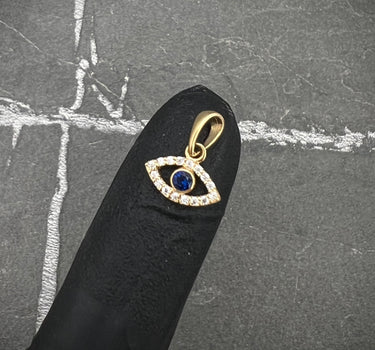 Dije ojo turco piedra central azul oscura 0.6gr / 1.3cm / Oro Amarillo Nac B