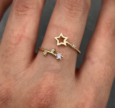 Anillo estrella con swarovski morado y blanco 1.3gr / TALLA 7 3/4 / Oro Amarillo Nac B