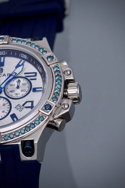 Reloj Bracarli Metal II. Oro Blanco 18k 7.8gr Con 1.80Qts (180Pts) De Diamante Azul Caja Blanca , Fondo Blanco Y Correa Azul M