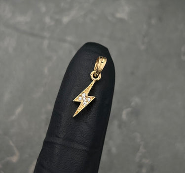 Dije rayo con swarovski blanco 0.6gr / Largo 1.8cm / Oro Amarillo Nac M