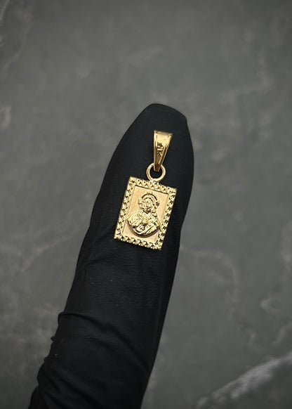 Dije corazon de jesus y virgen del carmen 0.5gr / Largo 1.8cm / Oro Amarillo Nac B