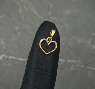 Dije silueta de corazon 0.5gr / Largo 1.4cm / Oro Amarillo Nac M