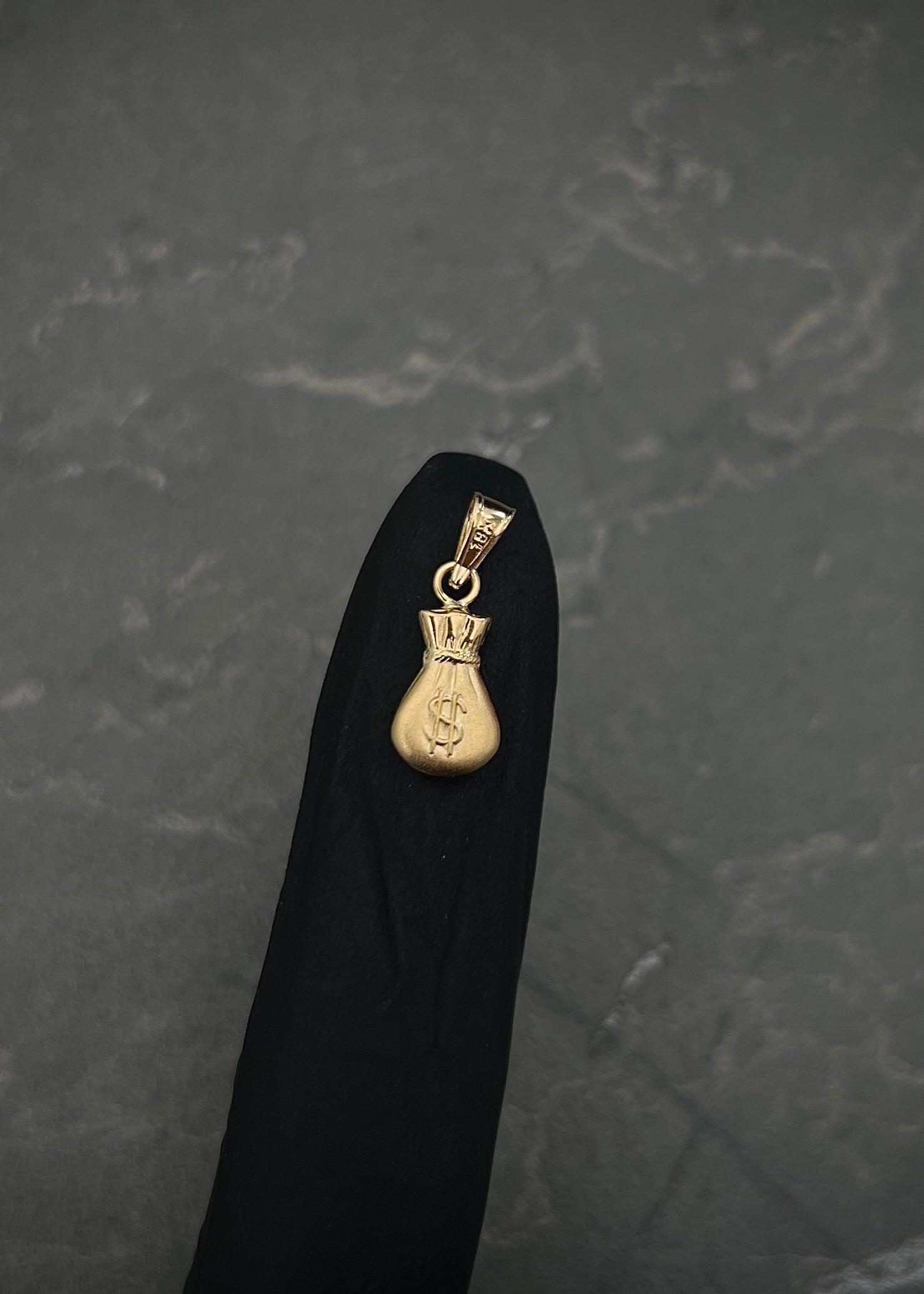 Dije bolsa de dinero 0.4gr / Largo 1.8cm / Oro Amarillo Nac B