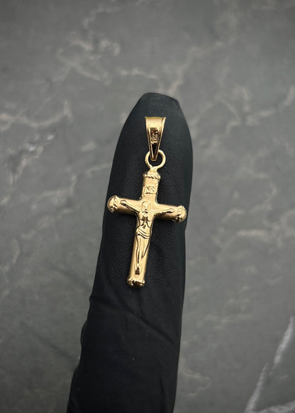 Dije cruz con cristo 0.7gr / Largo 2.9cm / Oro Amarillo Nac B