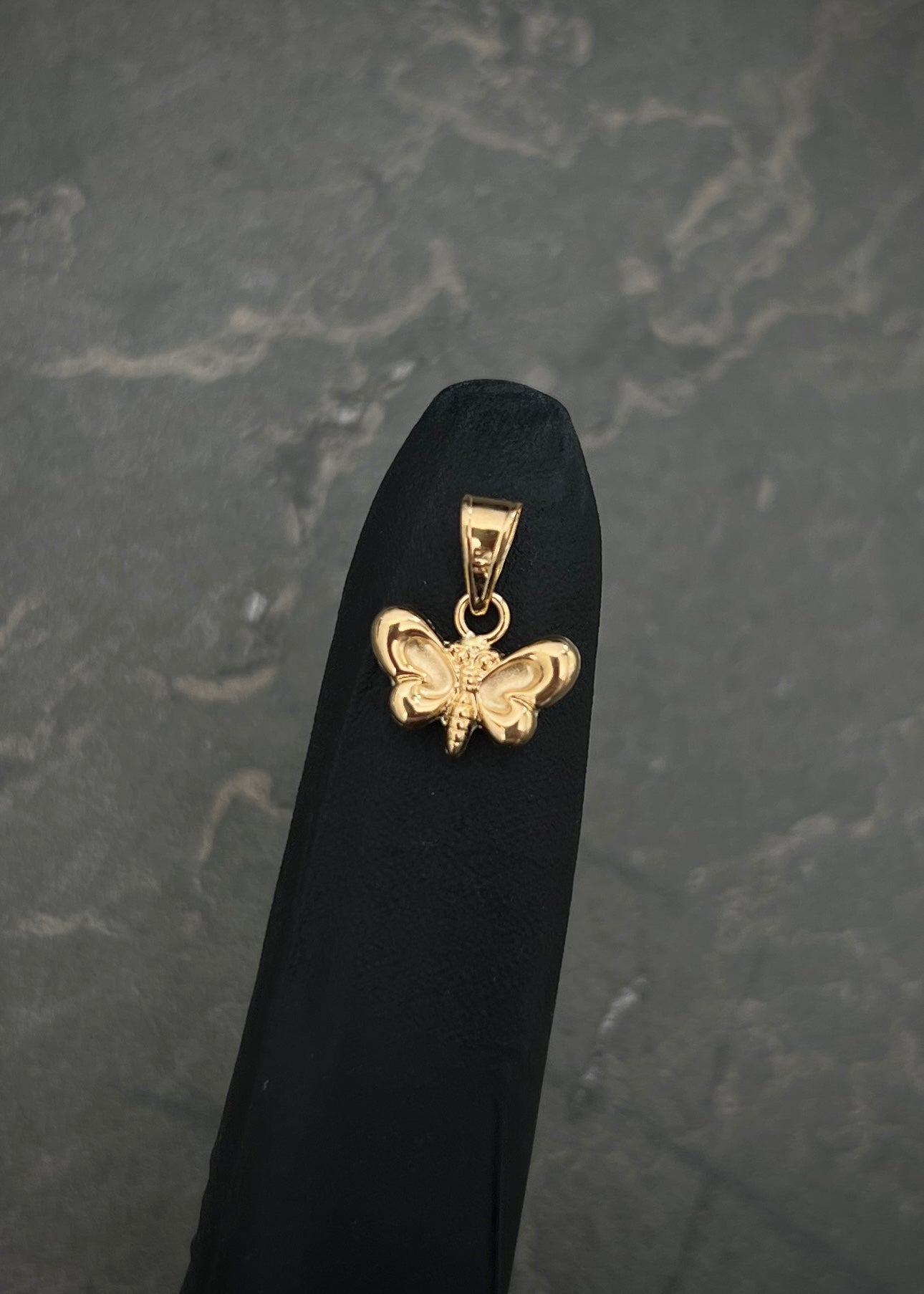 Dije mariposa 0.4gr / Largo 1.3cm / Oro Amarillo Nac M