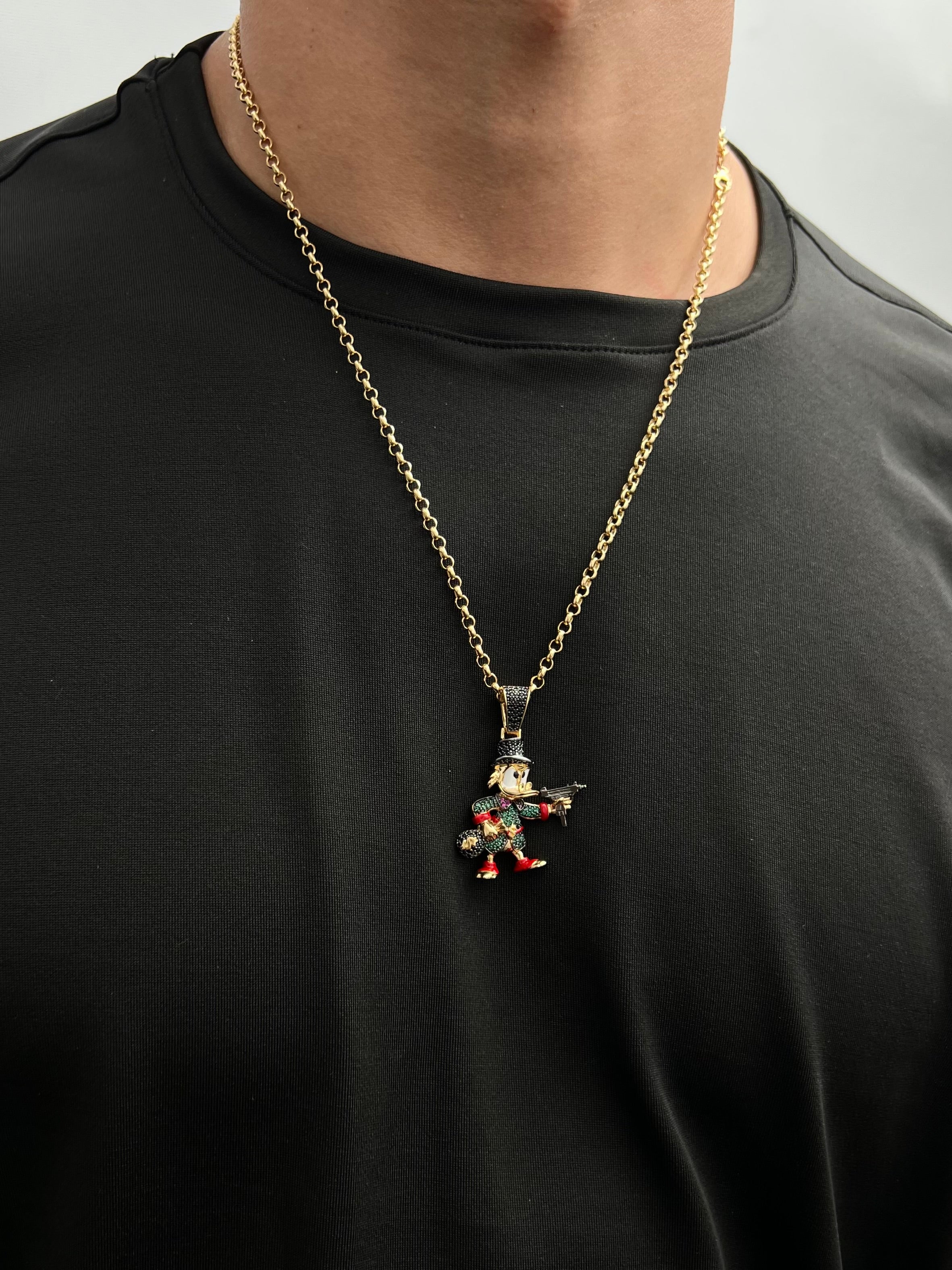 Dije tio rico con swarovski verde y negro 11.2gr / Largo 4.3cm / Oro Amarillo Nac M