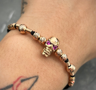 Pulsera de hilo negro con herraje de calavera y bolas diamantadas con herrajes de tubo 6.85gr / Oro Rosado (Joya) M