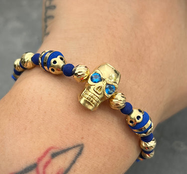 Pulsera de hilo azul con herraje de calavera y bolas diamatadas 10.8gr / Oro Amarillo (Joya) M