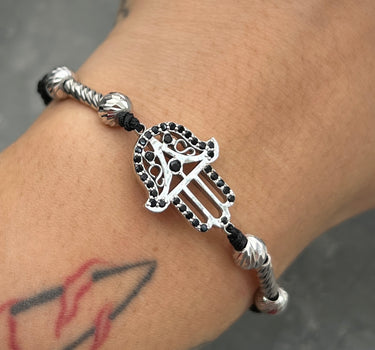 Pulsera de hilo negro con herraje mano hamsa y bolas diamantados con herrajes de tubo 5.15gr / Oro Blanco (Joya) M