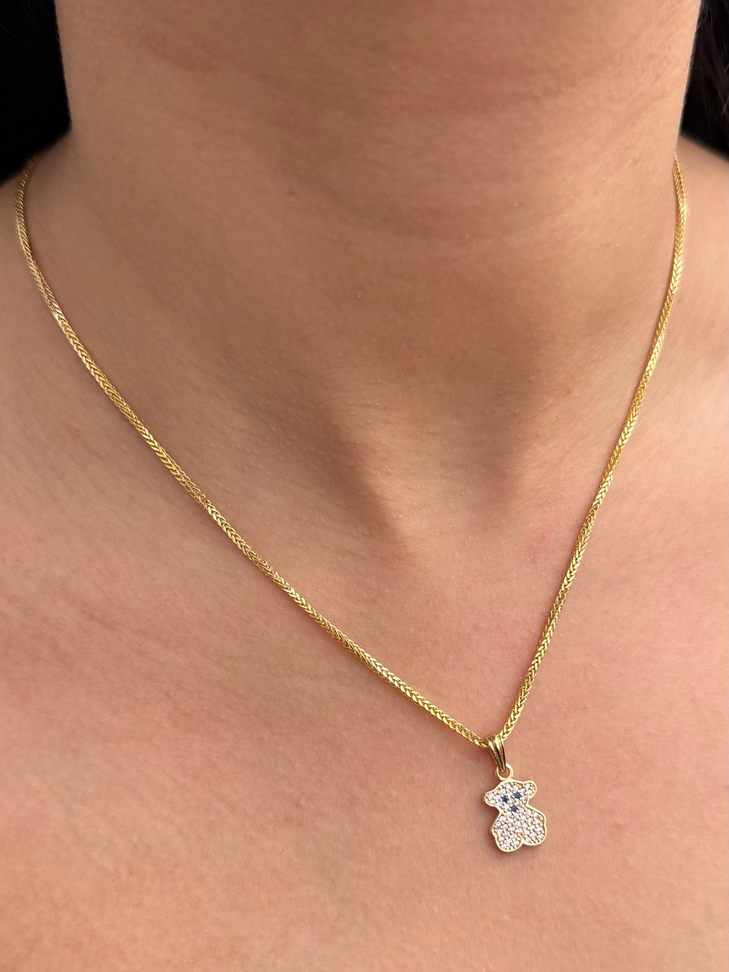 Dije Oso Th con Swarovski Blanco y Azul 1.35gr / 2cm / 9.9mm — Oro Amarillo