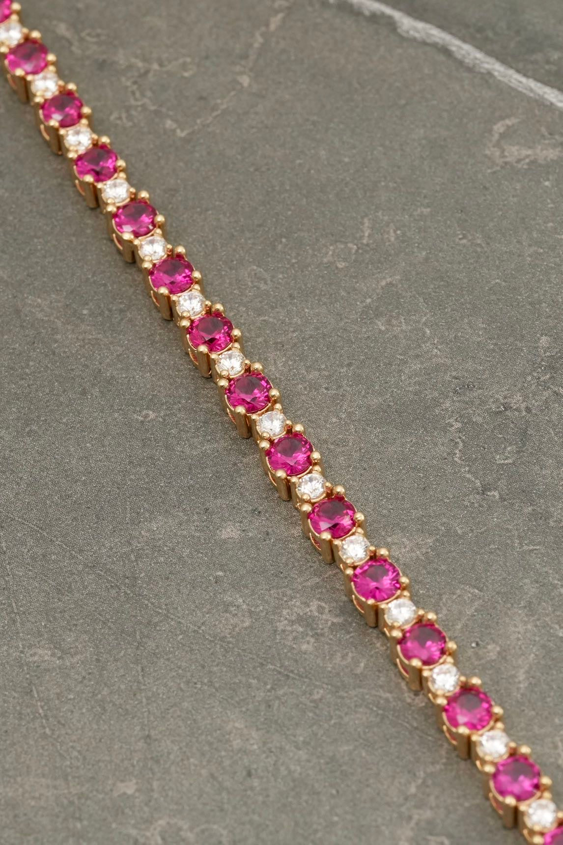 Pulso tenis con swarovski fucsia y blanco 19.35gr / Largo 17.5cm / Oro Amarillo Nac M