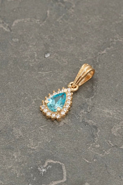 Dije gota con swarovski blanco y azul 1.15gr / Largo 1.7cm — Oro Amarillo