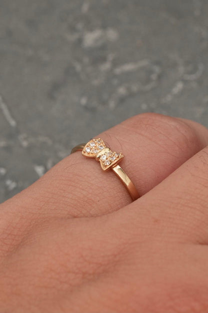 Anillo moño con swarovski blanco 1.25gr / TALLA 6 / Oro Amarillo Nac B