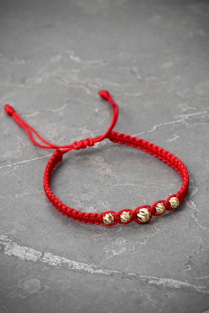 Pulsera en hilo rojo con bolas diamantadas 0.45gr / Oro Amarillo (Joya) M
