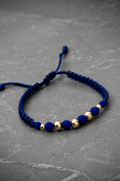 Pulsera en hilo azul con bolas lisas 0.75gr — Oro Amarillo