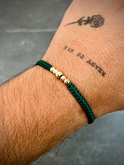 Pulsera en hilo verde con bolas diamantadas 0.45gr / Oro Amarillo (Joya) M