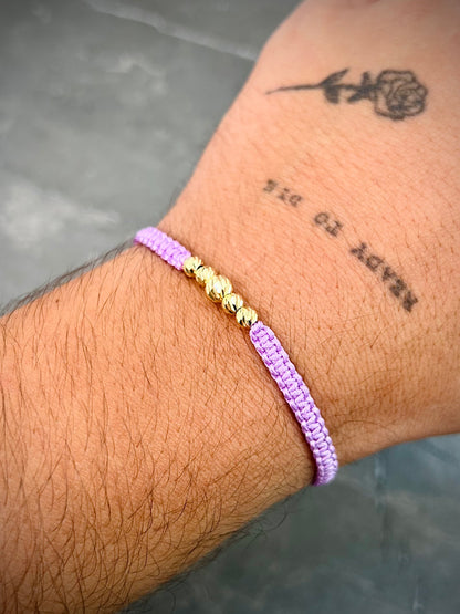 Pulsera en hilo morado con bolas diamantadas 0.45gr / Oro Amarillo (Joya) M